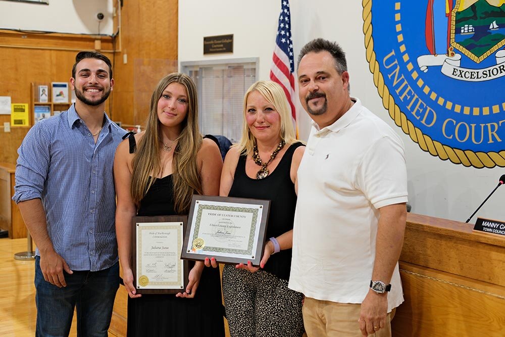Juliana Juras poses with her family after being honored by the Ulster County Legislature and the Town of Marlboro for her athletic achievements.